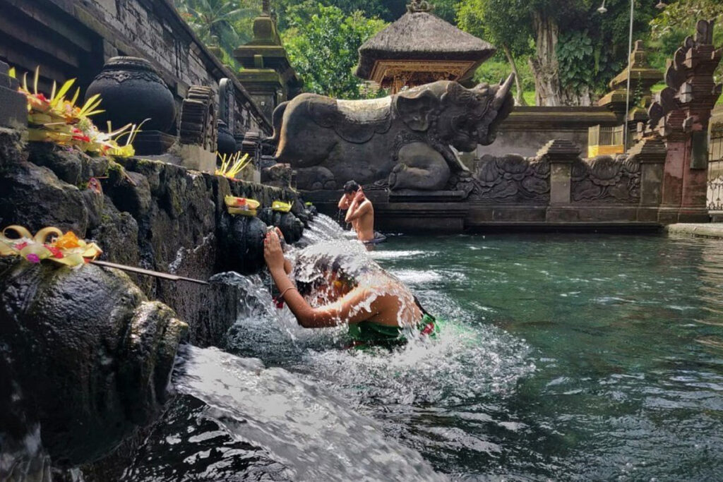 Melukat ritual with offerings and incense