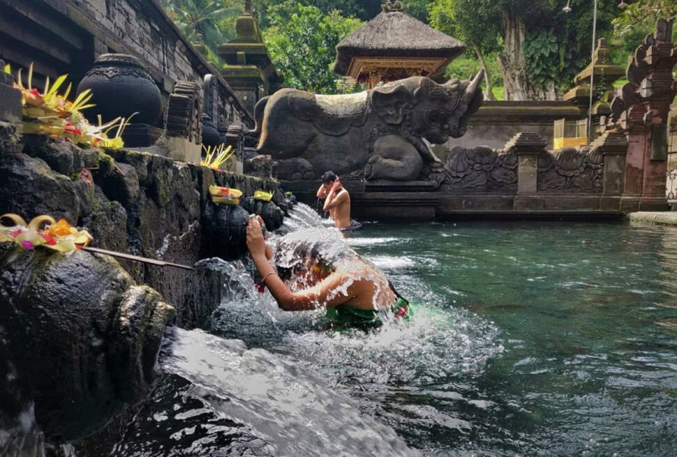 Melukat ritual with offerings and incense
