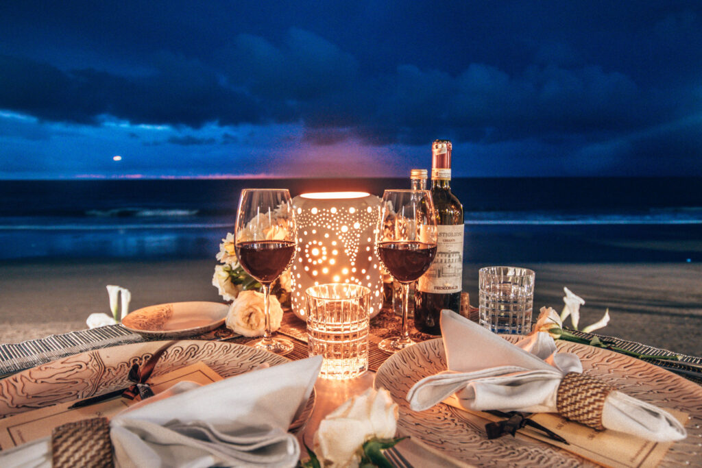 Romantic Christmas dinner table setup on a beach